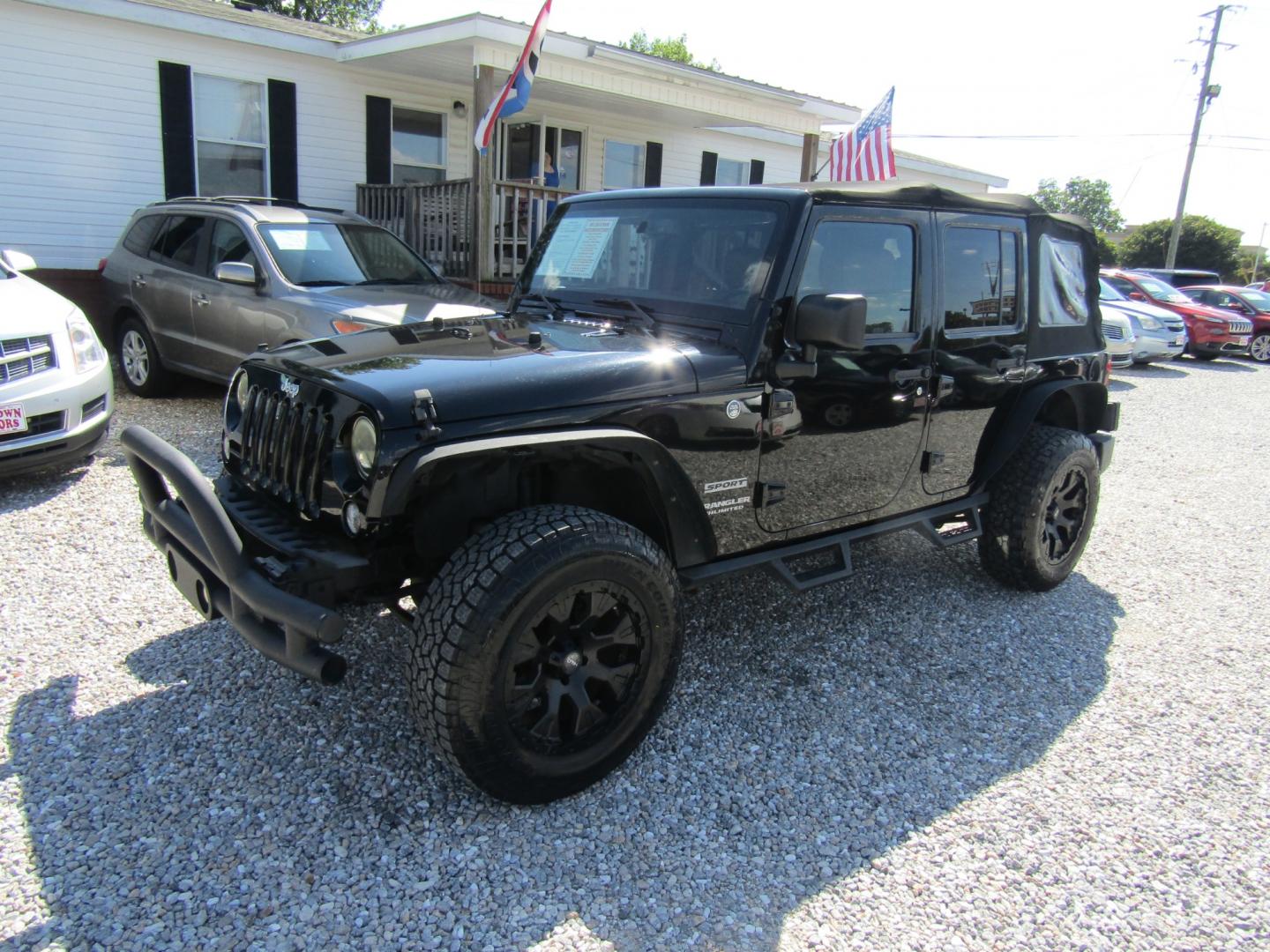 2015 Black /Tan Jeep Wrangler (1C4BJWDG8FL) with an V6 engine, Automatic transmission, located at 15016 S Hwy 231, Midland City, AL, 36350, (334) 983-3001, 31.306210, -85.495277 - Photo#2